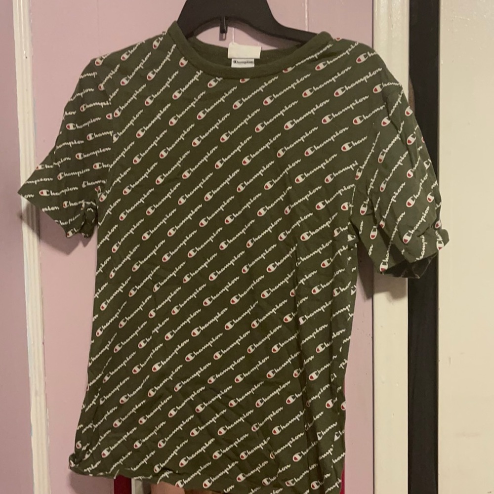Green shirt with the word champion printed